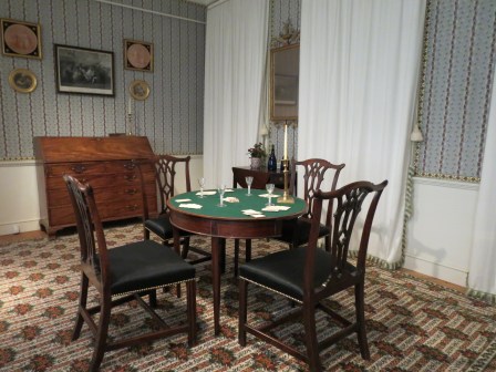 Georgian card table in a parlor. 